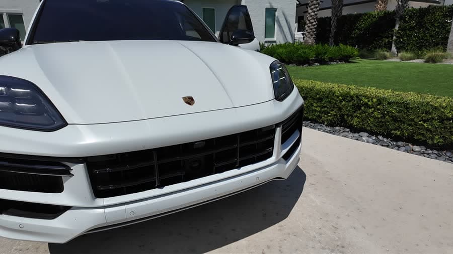 White Porsche Cayenne front end after paint correction