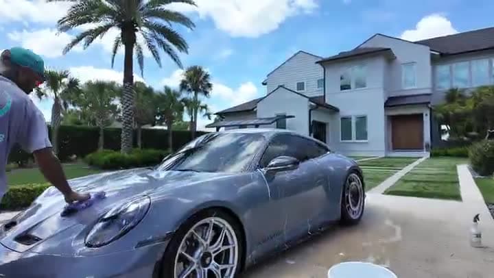 Grey Porsche 911 GT3 hand wash on a client driveway